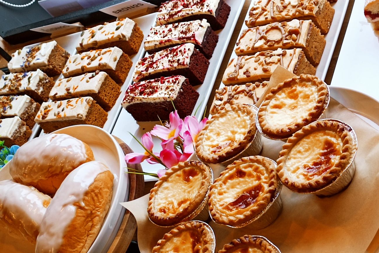 Brunos counter filled with colourful cake slices and golden pastries