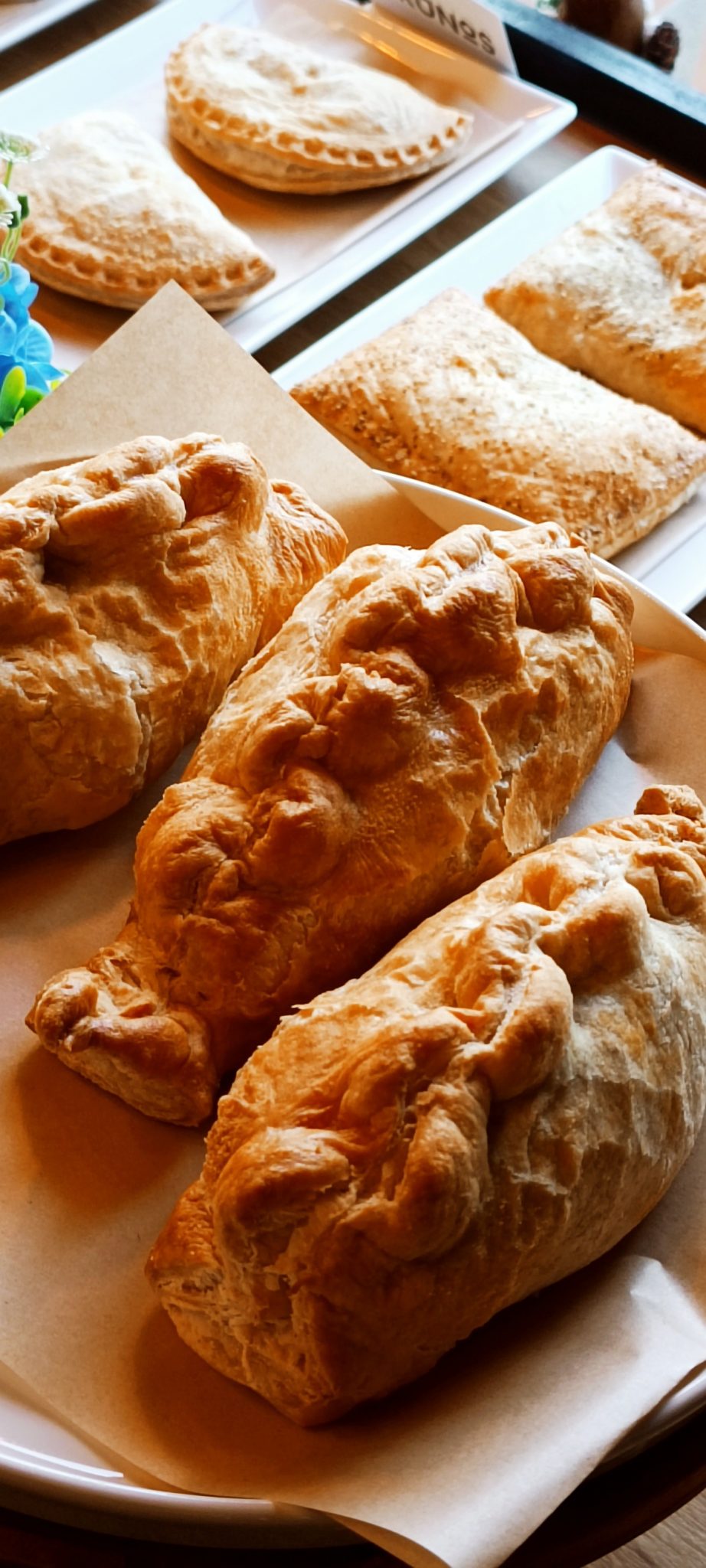 Golden savoury pasties on the Brunos counter
